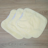 Pack 3 baberos rizo guardería color amarillo con elástico. Lavables, exterior de rizo y reverso impermeable. Medidas: 33x29cm